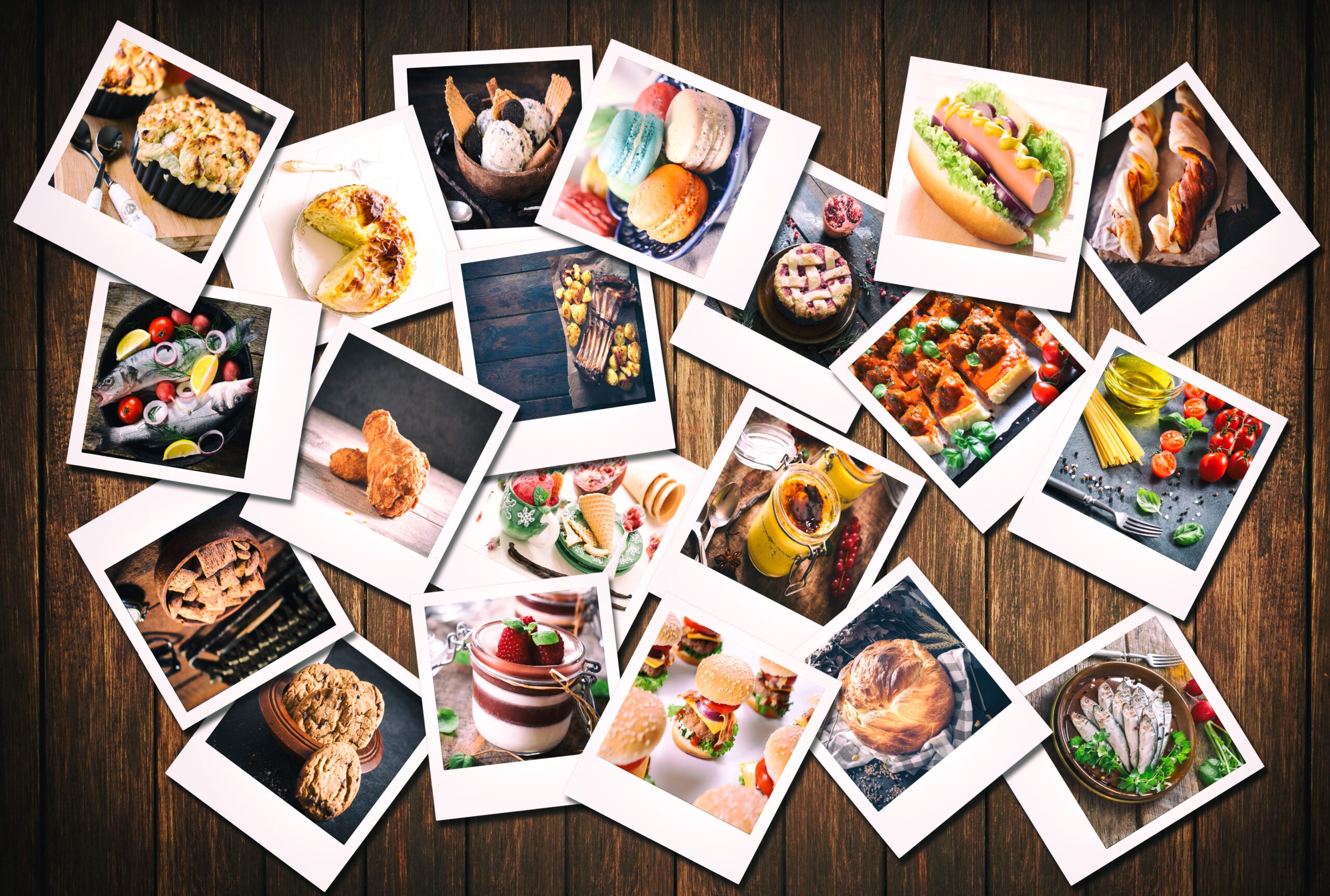 Large group of blank old camera films with food photos on wooden background