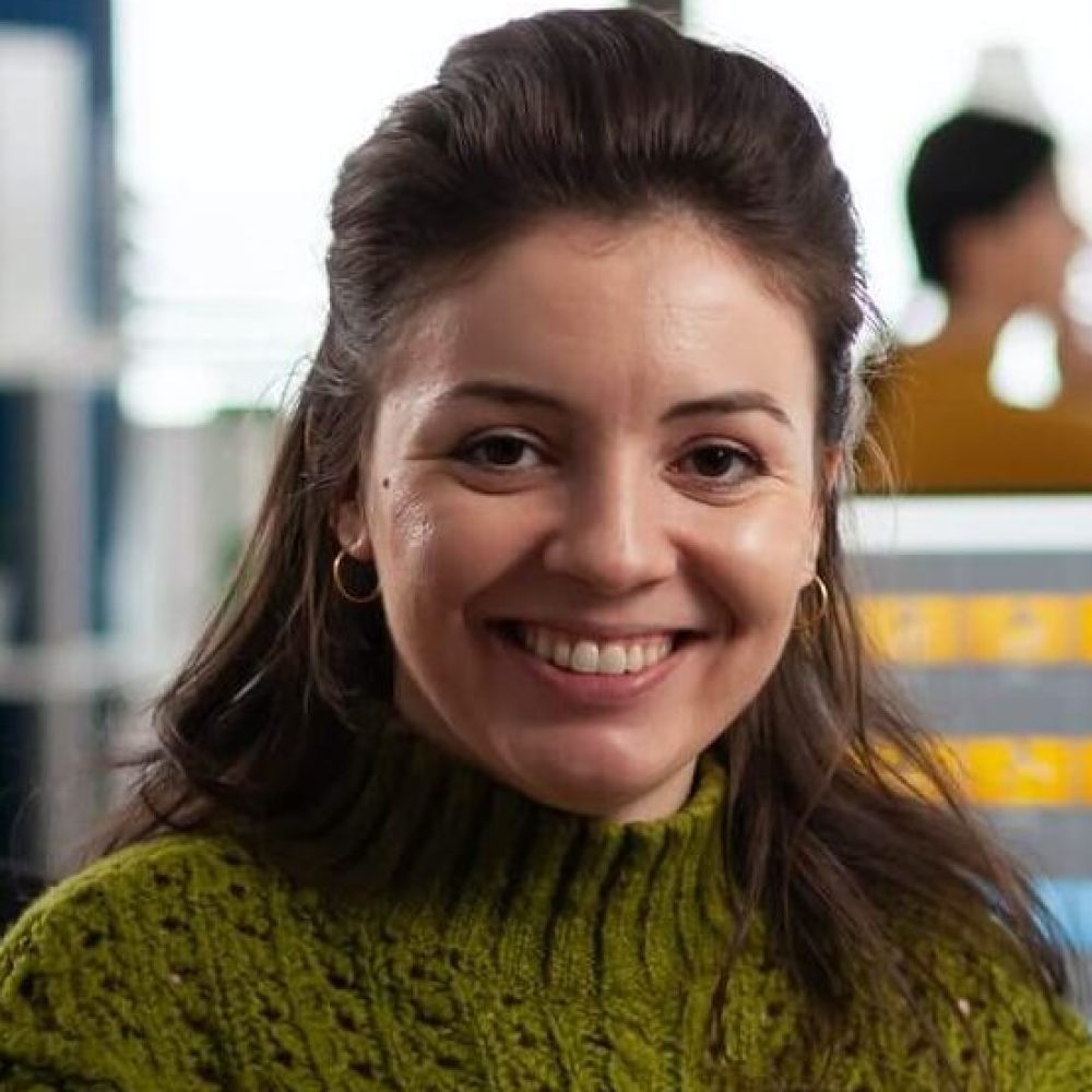 woman-retoucher-looking-at-camera-smiling-working-in-creative-media-agency-1.jpg